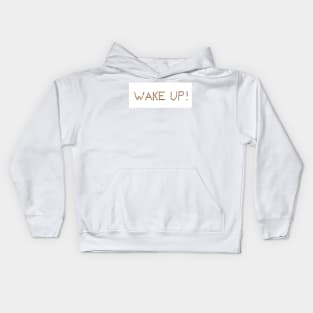 Writing WAKE UP! made of coffee beans isolated on white background Kids Hoodie